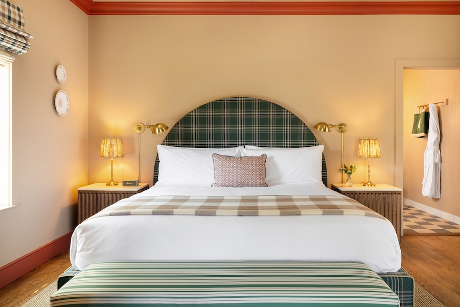 Le Petit Pali St. Helena napa valley california wine country vineyard guestroom cream walls orange crown molding green plaid headboard bed