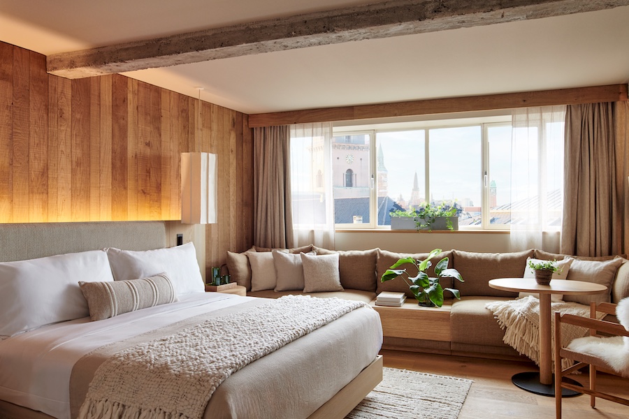 1 Hotel Copenhagen Bedroom Standard exposed concrete beam wood shiplap boards bed sofa couch