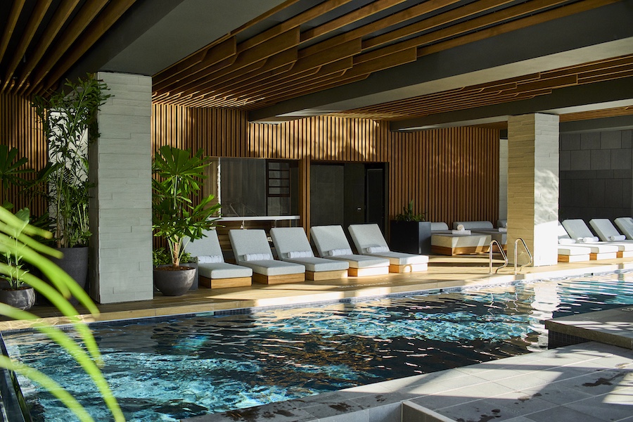 1 hotel melbourne pool loungers wood millwork fluted walls ceilings