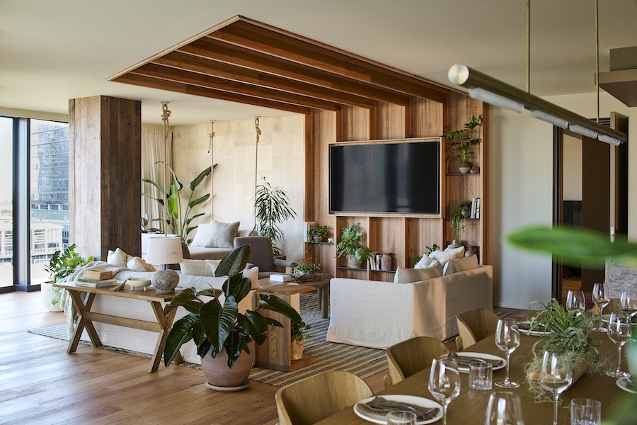 1 hotel melbourne river penthouse suite living room dining table wine glass indoor plant