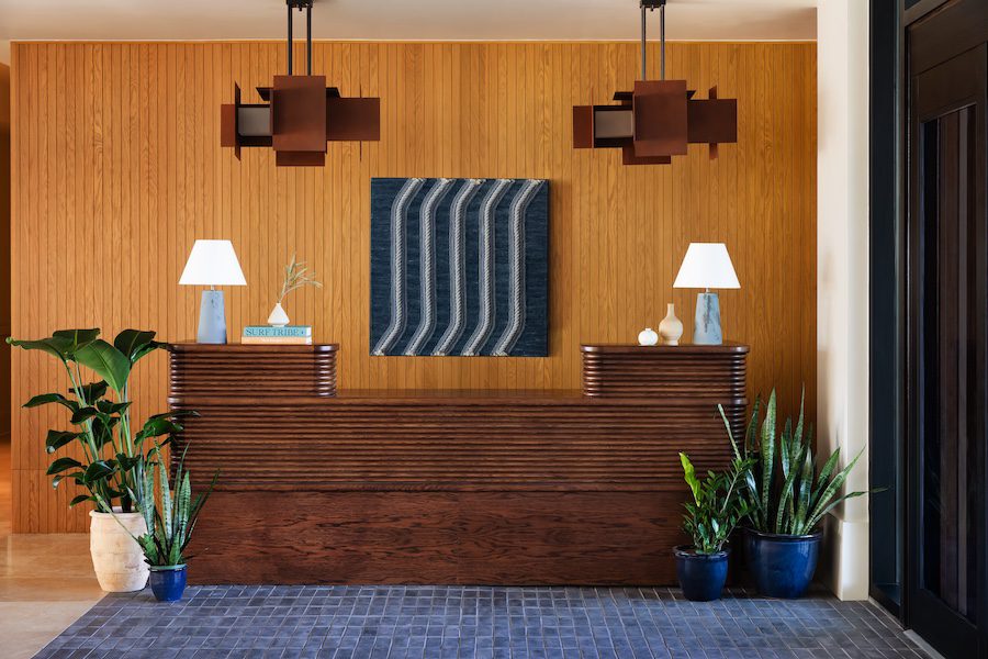 Trailborn Surf & Sound Wrightsville Beach north carolina lobby wood reception desk indoor plants