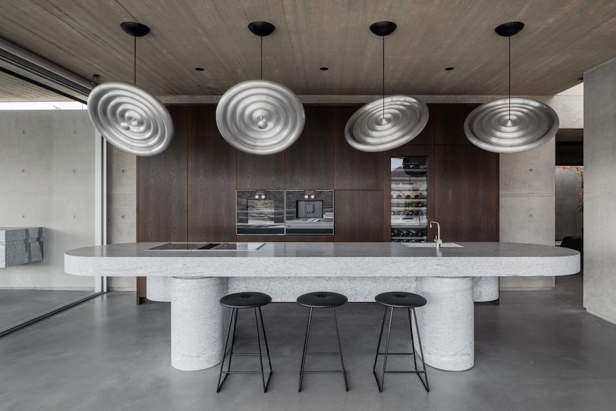 Aimasia Villa mykonos greece interiors kitchen metal light fixtures white bar island