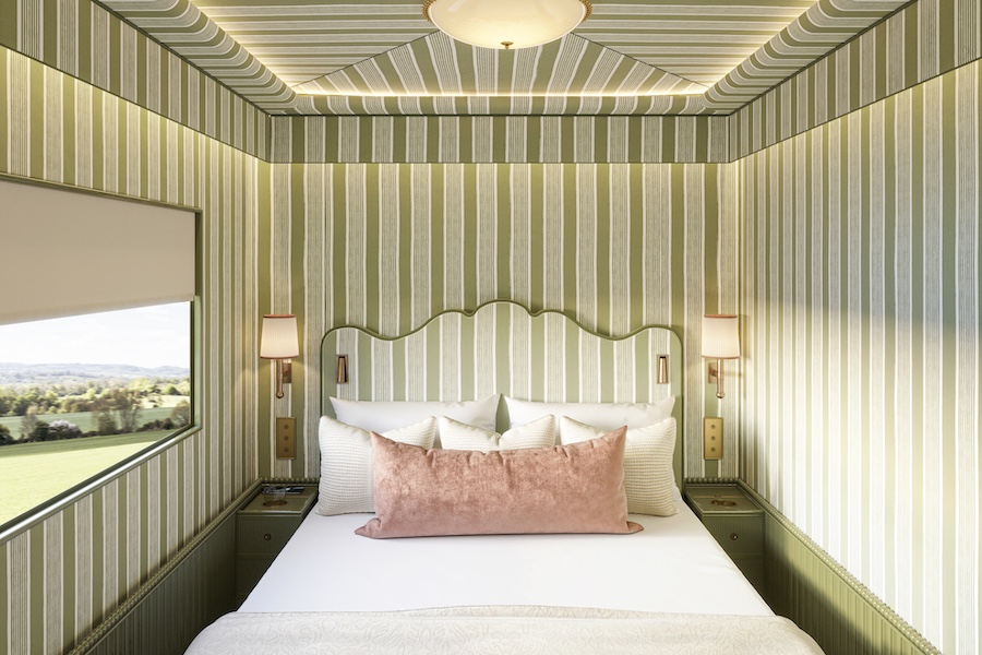 Britannic Explorer a Belmond Train UK luxury rail england wales interior car sleeper car striped green wallpaper headboard pink pillow
