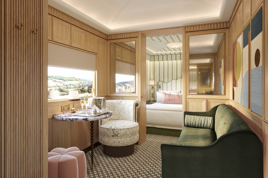 Britannic Explorer a Belmond Train UK luxury rail england wales interior car sleeper car striped green wallpaper headboard pink pillow green velvet sofa seating area