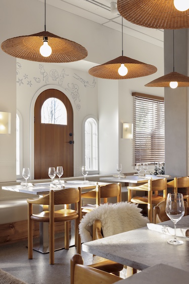 selene restaurant vancouver minimalist greek mythology mediterranean gray plaster polished concrete floors arched door