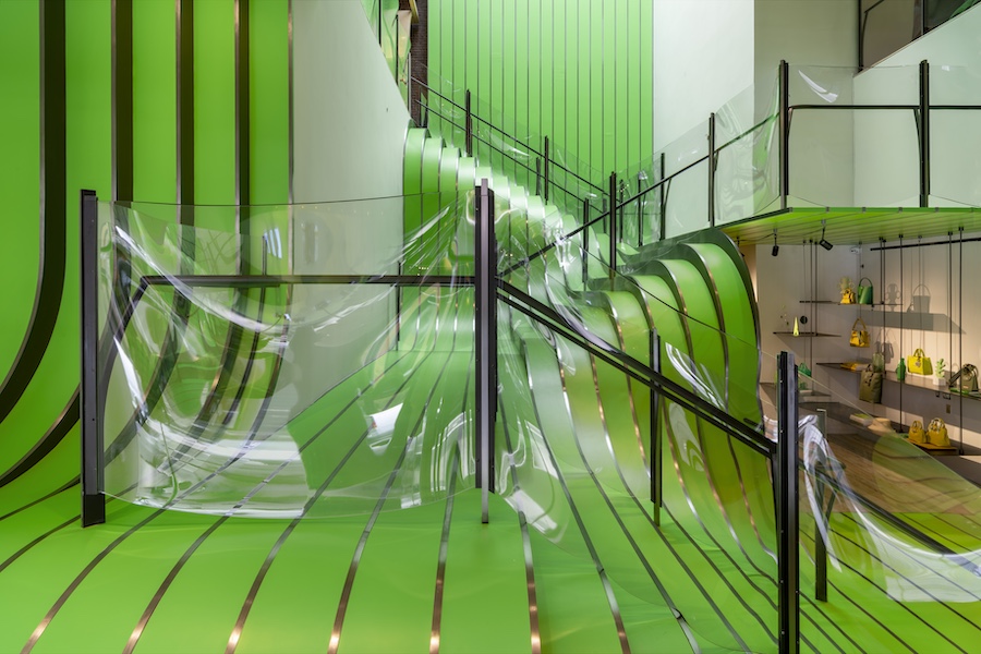 longchamp soho luxury retail store green staircase cascading