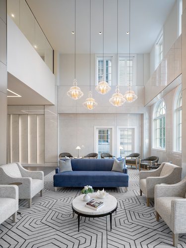 inspir embassy row washington dc senior living housing assisted living facility adaptive reuse lobby pendant lighting seating area