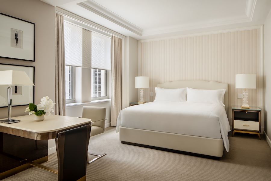 waldorf astoria new york park avenue junior suite bed shiplap wall neutral tones